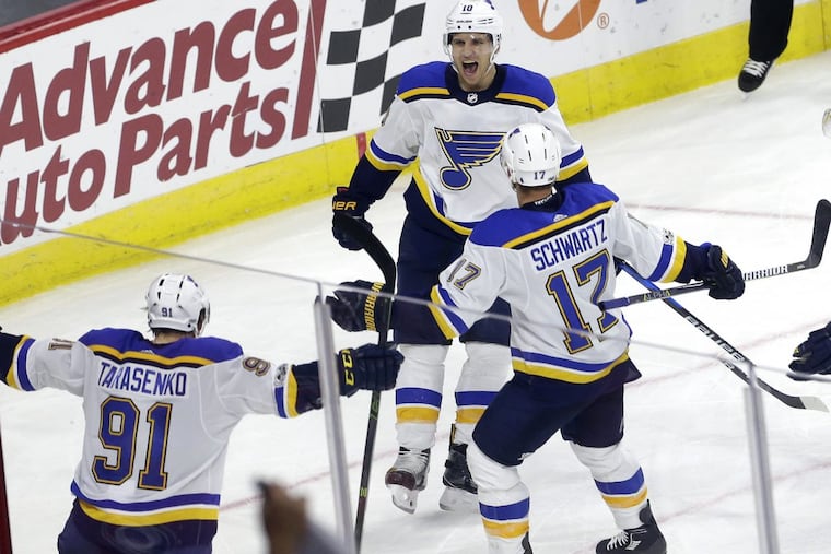 Former Flyer Brayden Schenn (background) has three goals and 11 points with the Blues.