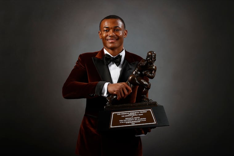 Alabama wide receiver DeVonta Smith poses for a photo after winning the Heisman Trophy.