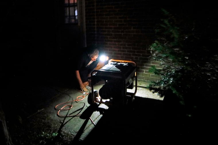 Dennis Reale operates a rented generator last week at his Drexel Hill home during a prolonged power outage caused by Tropical Storm Isaias. Some homeowners in Chester County are still upset with Peco days after the storm because they say the company's customer service representatives told them their power was on when it was not.