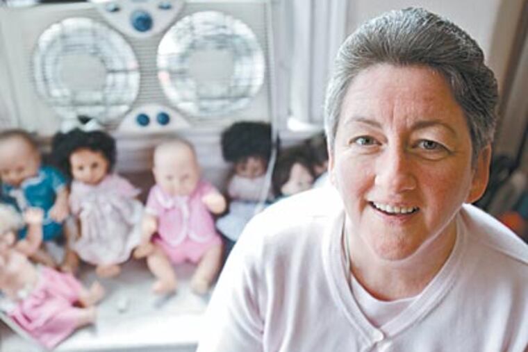 Sister Helen Cole in her office at Guadalupe Family Services. She has been helping children and families in Camden for nearly 20 years. (DAVID M WARREN / Staff Photographer)