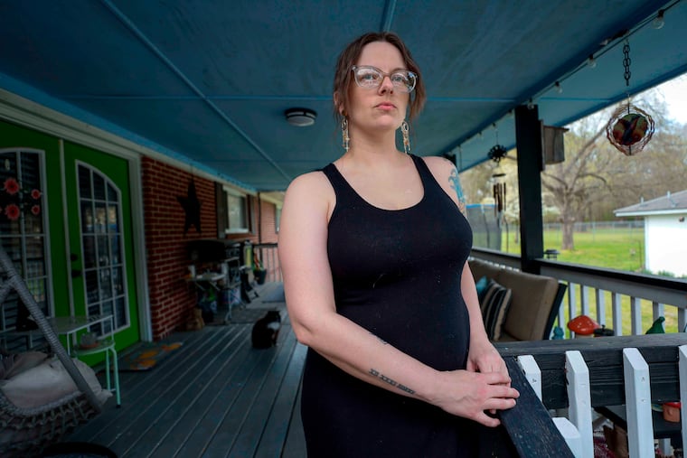 Stormy Bost stands on her porch in Calhoun, Ga., on March 29.