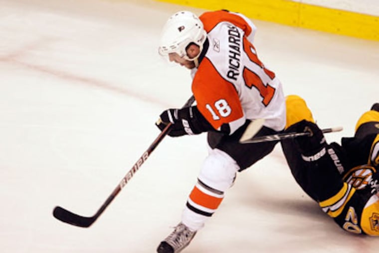 Mike Richards believes that commitment is the key to tonight's game. (Yong Kim / Staff Photographer)