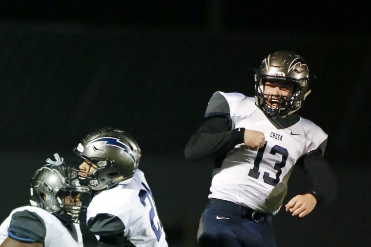 Timber Creeks’ Devin Leary (right) celebrates a touchdown.