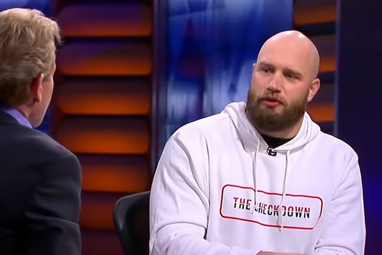 Eagles offensive lineman Lane Johnson (right) speaks to FS1 host Skip Bayless during an interview on 'Undisputed' Thursday morning.