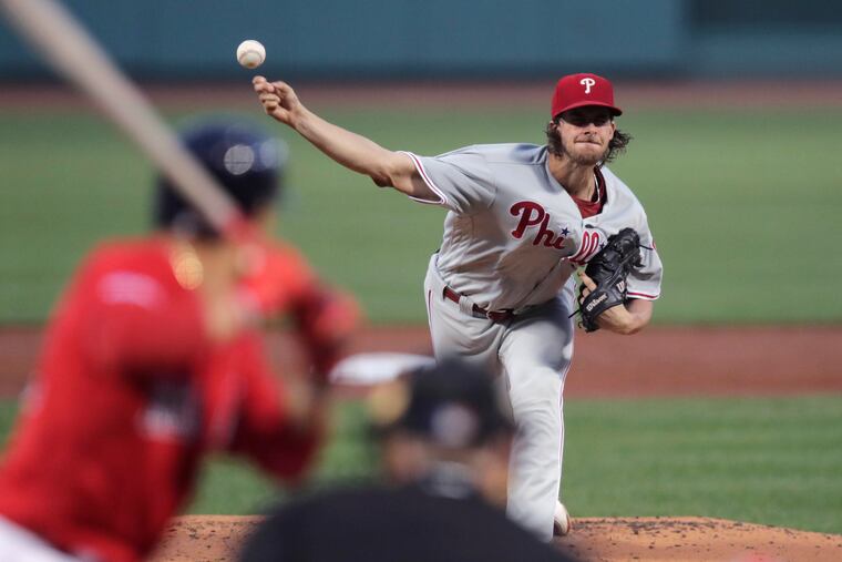 Phillies starting pitcher Aaron Nola delivers during the first inning of a 3-2 win Tuesday against Boston.
