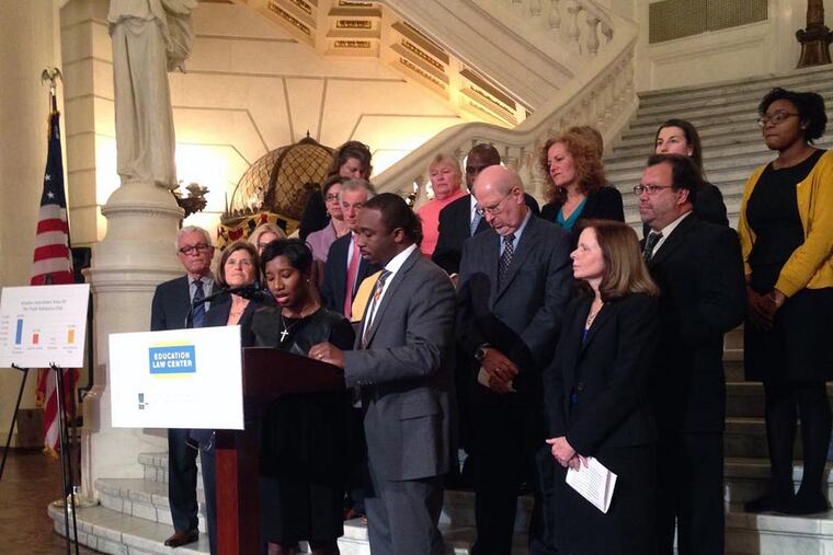 Jamella Miller, a parent in the William Penn school district, talks about why she and her husband Bryant Miller (standing to her left) decided to join the lawsuit as plaintiffs.