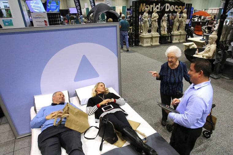 Visitors check out a bed at the Sleep Number exhibit at the 11th Annual Orlando Home & Garden Show, at the Orange County Convention Center in January 2019.