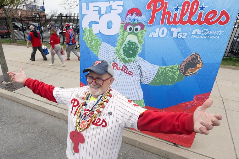 Steve Wilson from Bucks County poses with a Philly Phanatic backdrop, during Phillies' home opener at Citizens Bank Park.