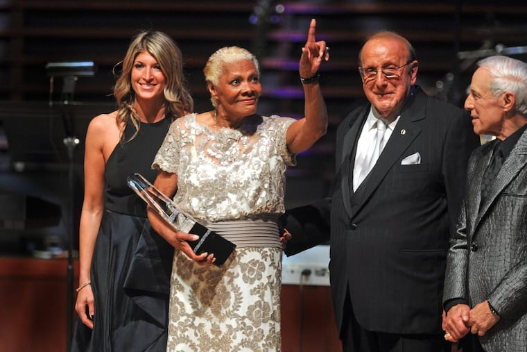 Dionne Warwick holds her 2017 Marian Anderson Award at the Kimmel Center during a gala concert event Tuesday night, November 14, 2017. With her are award board chairwoman Nina Tinari Schulson, record producer Clive Davis, and longtime Philadelphia DJ Jerry Blavat (right).