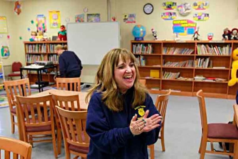 Principal Debra Drossner celebrates with applause that Bayard Taylor Elementary School will remain open, March 8, 2013. ( DAVID SWANSON / Staff Photographer )