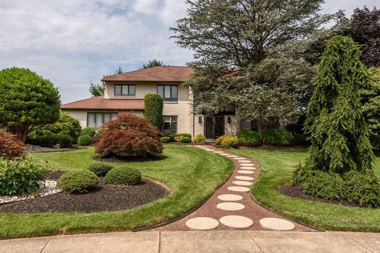 The home features a fully custom eat-in kitchen with an island as well as a master suite that takes up more than half of the home’s second floor.