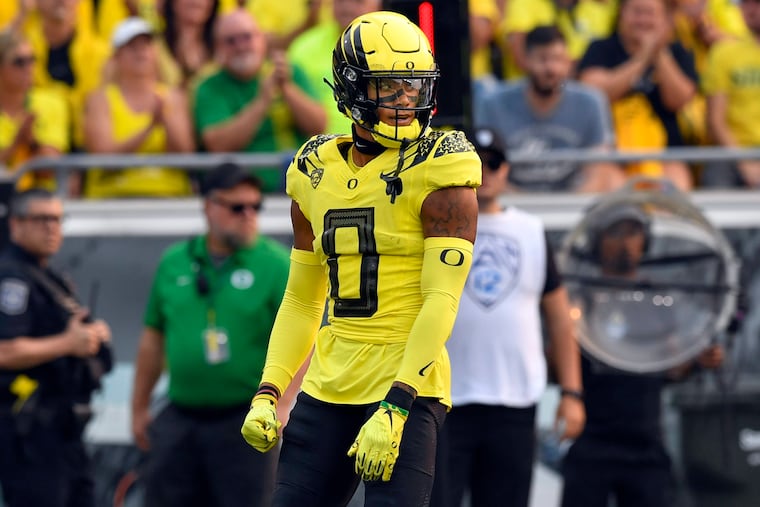 Oregon defensive back Christian Gonzalez (0) checks on defensive calls against Eastern Washington during the first quarter of an NCAA college football game Saturday, Sept. 10, 2022, in Eugene, Ore. (AP Photo/Andy Nelson)