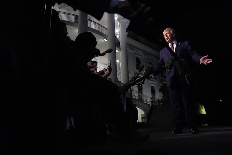 President Donald Trump talks to the media on Dec. 19, 2025, as he walks to Marine One from the White House.