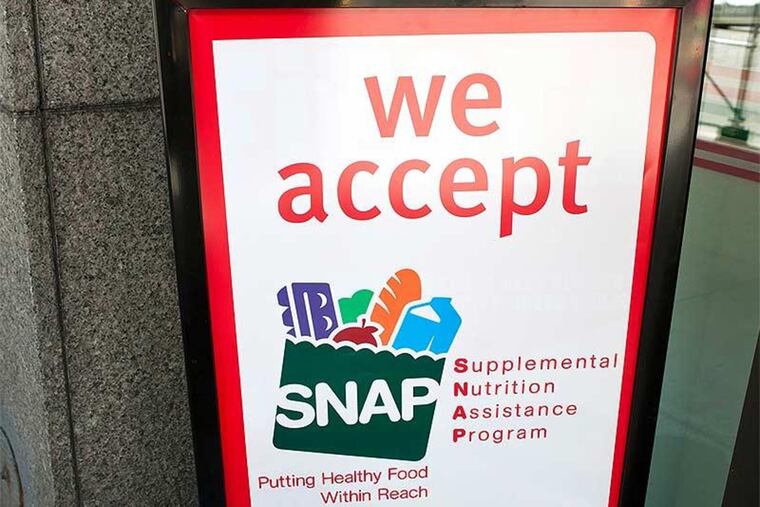 A sign indicates a store that accepts the Supplemental Nutritional Assistance Program or SNAP, the official name of the food stamp program.