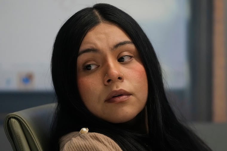 Marimar Martinez, a woman who was shot by a Border Patrol agent last year, sits with her attorneys during a press conference in Chicago on Wednesday.