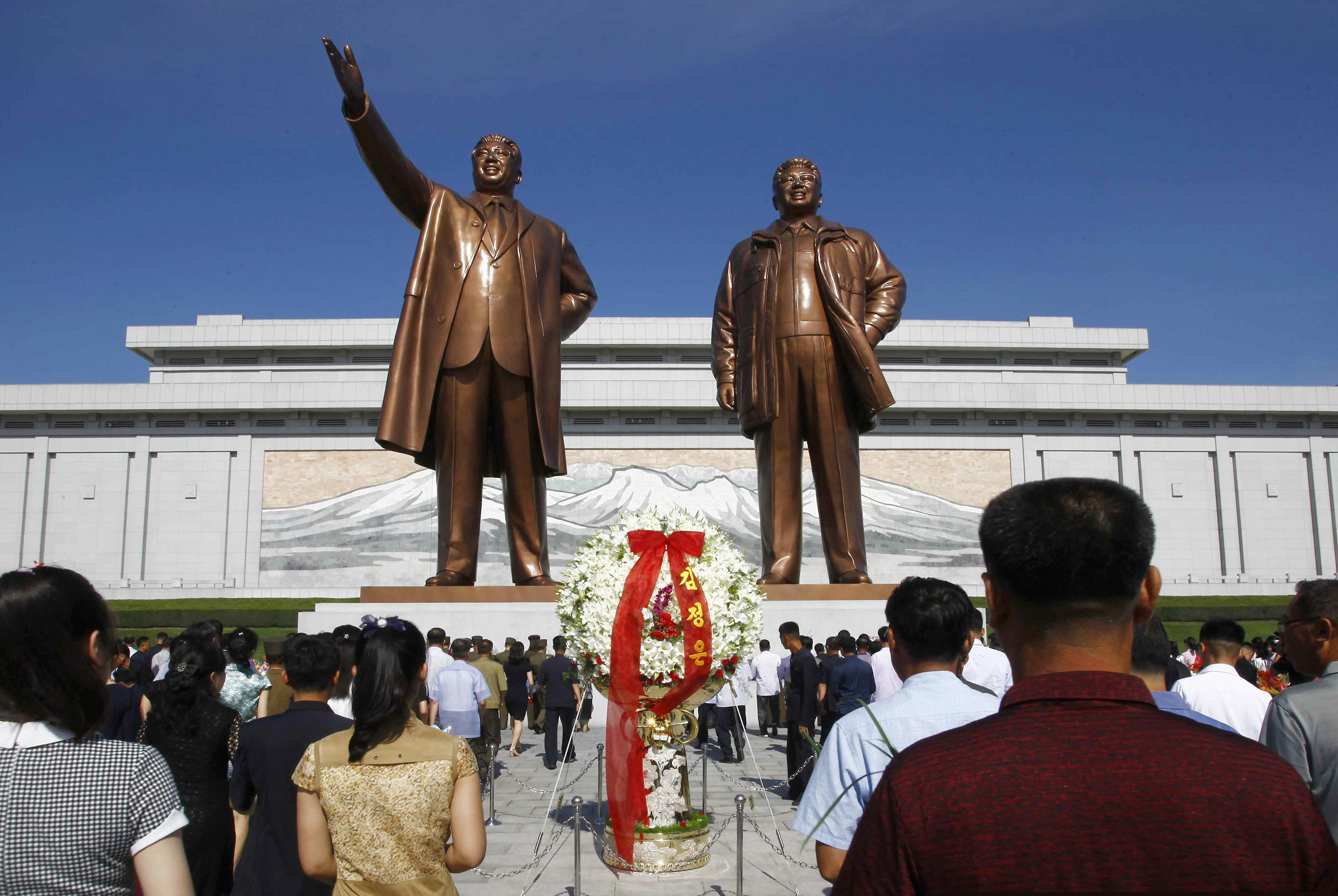 People visit Mansu Hill to pay tribute to the late leaders Kim Il Sung and Kim Jong Il on the occasion of the 25th anniversary of Kim Il Sung's death, in Pyongyang, North Korea. The Trump administration on Friday sanctioned a notorious if opaque constellation of North Korean hackers believed to be responsible for dozens of cyber attacks around the world, including the 2014 hacking of Sony Pictures.