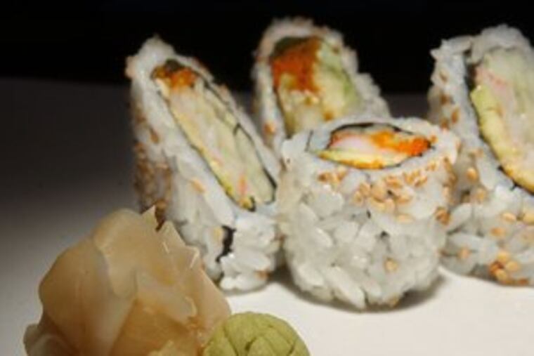 A wasabi and pickled ginger (foreground). Sushi is eaten around the world.