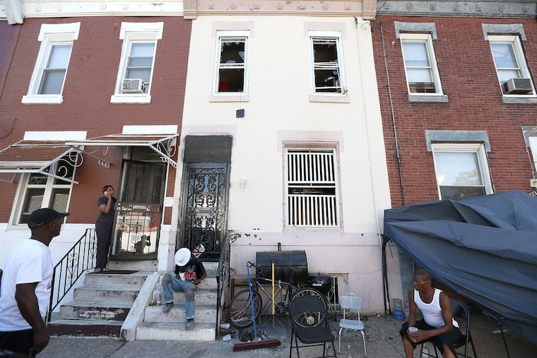 Exterior of a Wednesday morning double fatal fire in a row house on the 2700 block of N. 9th Street in Philadelphia, PA on July 11, 2018.