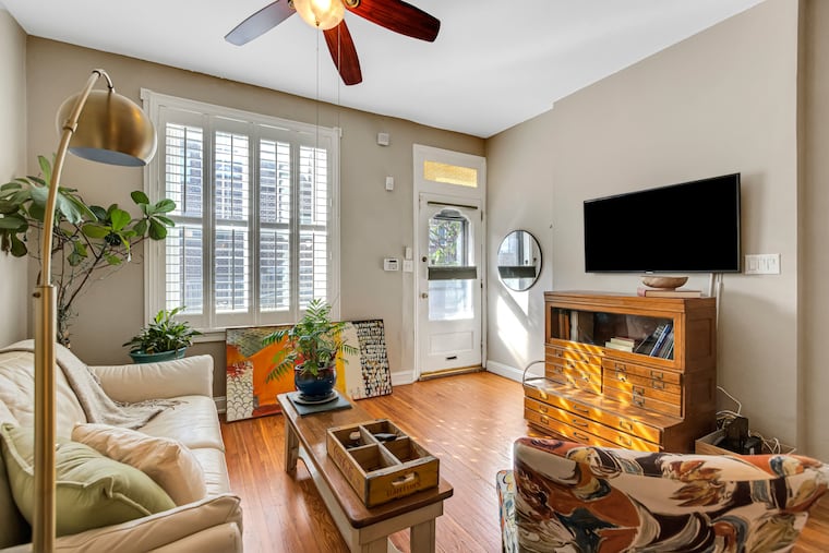 The living room of the house, built in 1916, has 10-foot ceilings.