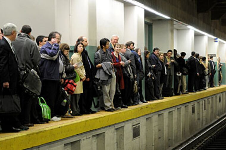 Suburban Station SEPTA commuters on a platform at Suburban Station yesterday. This morning, not only did the strike continue, but a fire shut down key regional lines. (Kriston J. Bethel / Staff Photographer)