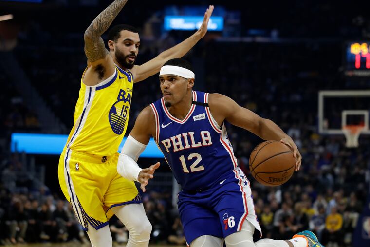 Tobias Harris (12) drives against the Golden State Warriors' Michael Mulder during the first half Saturday night.
