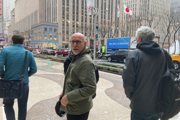 Players Association lead negotiator Bruce Meyer, center, and general counsel Ian Penny, right, leave Major League Baseball’s office in New York after delivering a counterproposal to the league Wednesday.