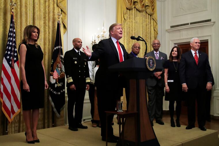 President Donald Trump, with first lady Melania Trump (left), Vice President Mike Pence (right), and his wife, Karen Pence, speaks during a National African American History Month reception in the East Room of the White House in Washington, Thursday, Feb. 21, 2019.