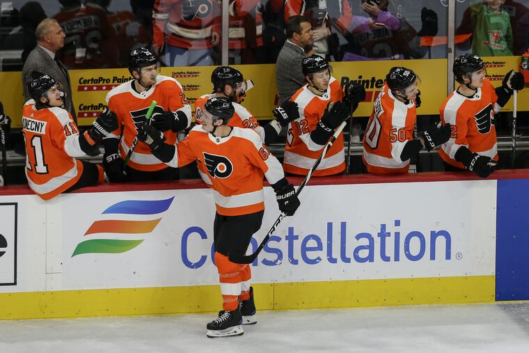 The Flyers' Justin Braun celebrates his empty-net goal against the Penguins.