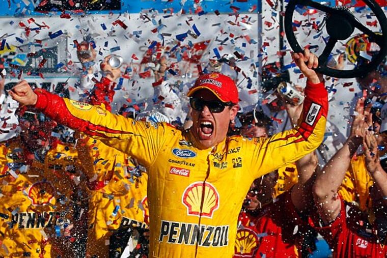 NASCAR Sprint Cup Series driver Joey Logano (22) celebrates winning the Daytona 500 at Daytona International Speedway. (Peter Casey/USA Today)