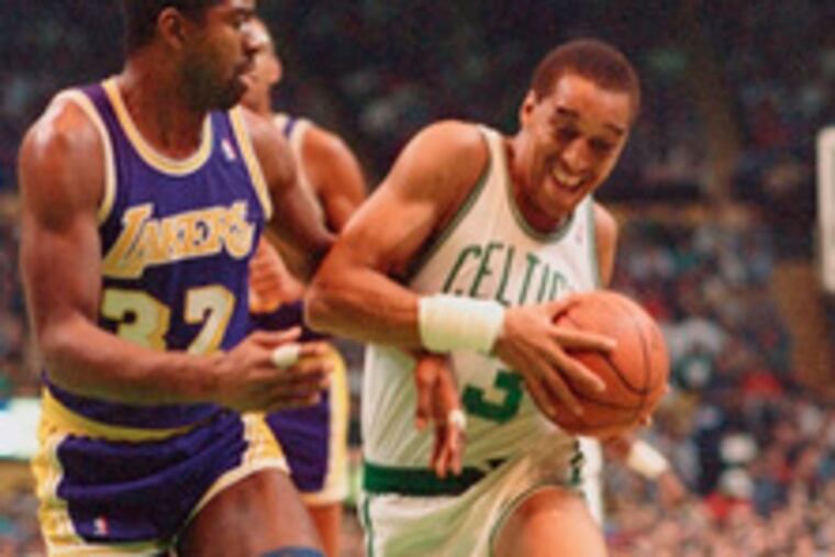 Dennis Johnson driving the lane against Magic Johnsonof the Los Angeles Lakers. The action occurred in 1986.