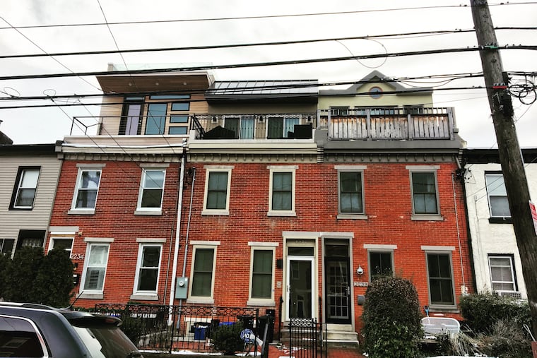 The three completely different overbuild designs on these Bainbridge Street rowhouses in Graduate Hospital would have to be mansard roofs under the proposed conservation overlay district.