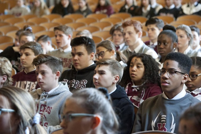 Holy Cross Academy students take part in an Ash Wednesday mass at the Delran, NJ based Roman Catholic high school on Wednesday, February 14, 2018. Holy Cross is the only Roman Catholic high school in Burlington County, NJ, and is closing at the end of the school year. A group of alumni are working on a plan to keep it open as an independent Catholic school. Avi Steinhardt / For the Philadelphia Inquirer