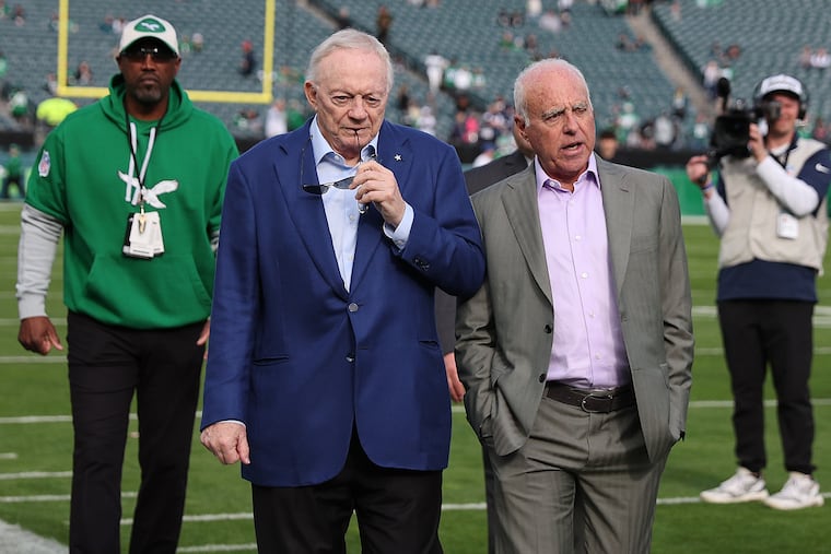 Dallas Cowboys owner Jerry Jones (left) and Eagles owner Jeffrey Lurie talk before their Dec. 29 matchup at Lincoln Financial Field.