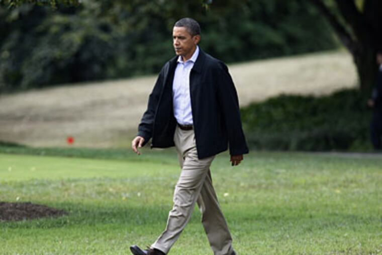 President Barack Obama walks on the South Lawn of the White House in Washington as he departs for the Camp David presidential retreat, Wednesday, Sept. 2, 2009. (AP Photo/Charles Dharapak)