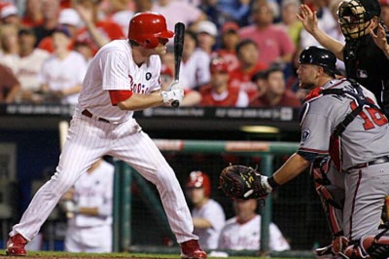 Chase Utley left Wednesday's game in the eighth inning after taking a pitch to the helmet in the sixth. (H. Rumph Jr/AP)