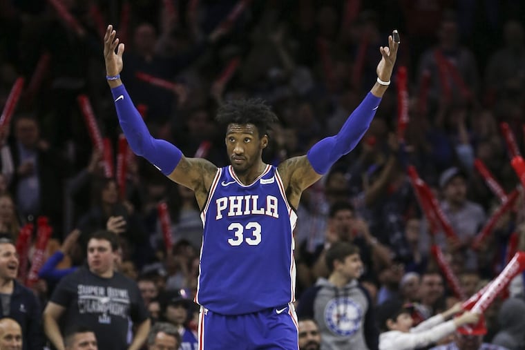 Robert Covington gets the fans involved during the Sixers’ 123-104 win over the Denver Nuggets Monday night.