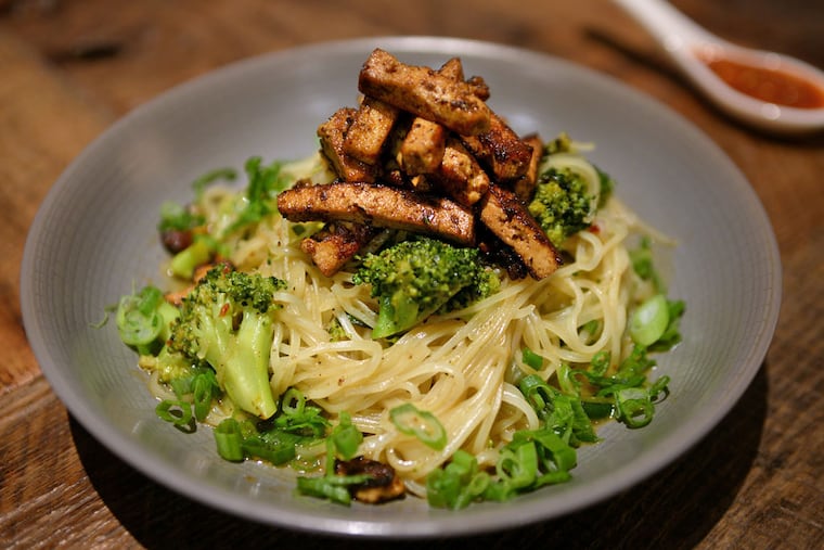 Singapore noodles with char siu tofu, broccoli, peanuts, and lime sambal. Global influences on V Street's concise, coherent vegan menu - just 13 savory items - include Hungarian, Peruvian, and Korean. (TOM GRALISH / Staff Photographer)