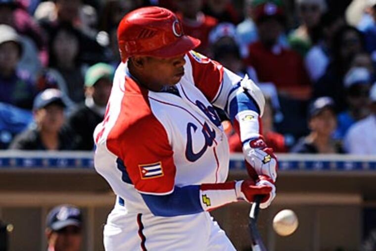 The Phillies are among the teams that have watched Yoenis Cespedes (above) and Jorge Soler work out. (Mark J. Terrill/AP)