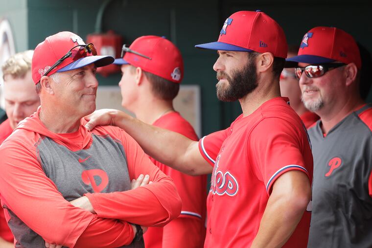 Phillies pitching coach Bryan Price, left, was absent from Saturday's game at Citizens Bank Park.