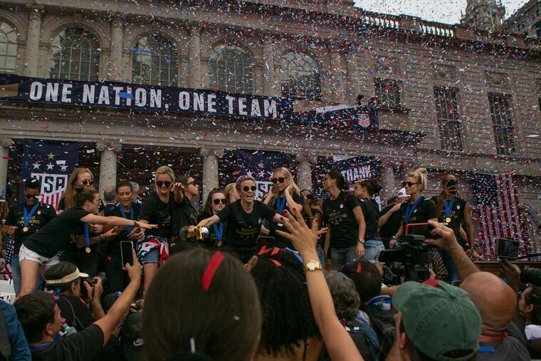 The U.S. Women's National Soccer team celebrates as confetti flies outside of New York City Hall at a ceremony following the team's parade down the Canyon of Heroes in lower Manhattan for their World Cup win on Wednesday, July 10, 2019. Ahead of their World Cup win, team members advocated for equal pay in line with compensation for the men's team.