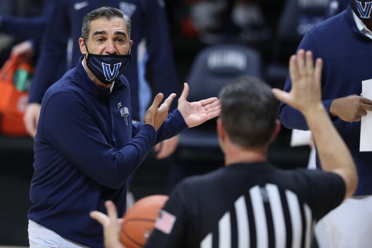 Coach Jay Wright, left, of Villanova argues with an official during the Wildcats' 85-66 victory over Butler.