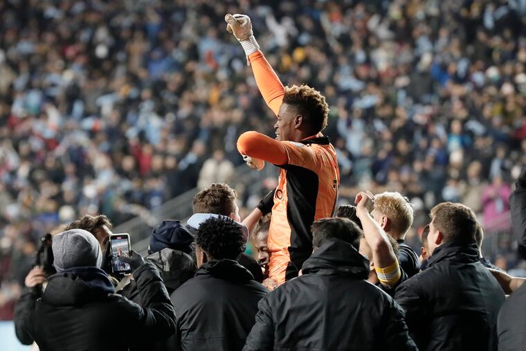 Andre Blake was carried down the field by his teammates after his penalty shootout heroics against Nashville.
