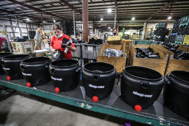 Sandy Fox assembles a Shop-Vac vacuum cleaner on the company's assembly line in Williamsport, Pa. Shop-Vac was left for dead a year ago by its previous owner, but it got picked up by GreatStar Tools USA, owned by a big Chinese tool maker. GreatStar has gotten Shop-Vac back up and operating in Pennsylvania under American management.