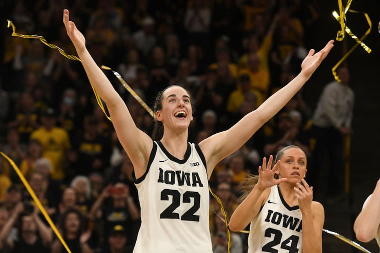 Caitlin Clark (22) celebrates during Senior Day ceremonies after a victory over Ohio State in which she became the top scorer in the history NCAA Division I men's or women's basketball.