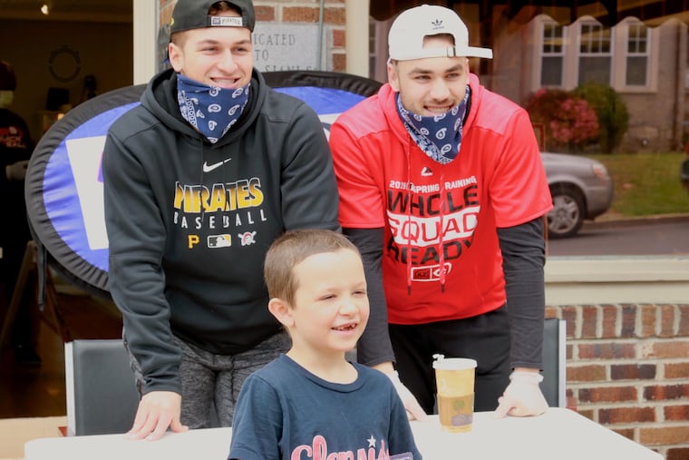 Sammy Siani (left) and his brother Mike Siani (right) at an event Saturday promoting Quickball.