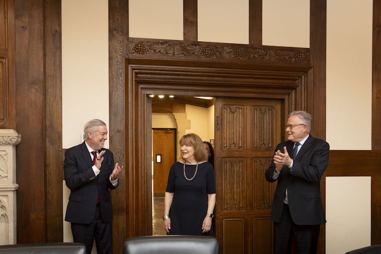 Temple President John Fry (left) and interim provost David Boardman (right) greet Jane Creamer Sullivan, who made one of the largest donations to Temple in its history to start an honors college.