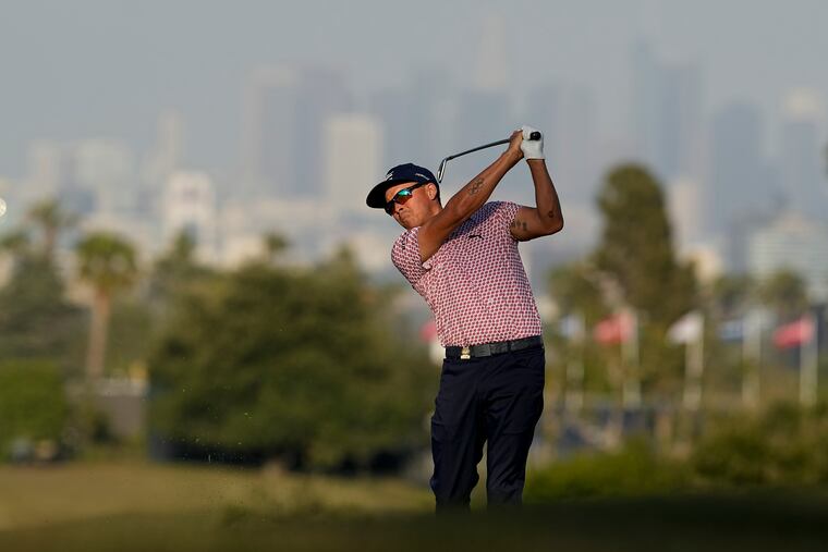 Rickie Fowler watches his tee shot on the 13th hole during the third round. He is tied atop the leaderboard heading into the final day.