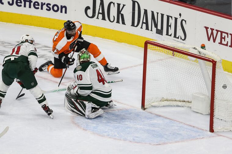 Flyers right winger Wayne Simmonds puts a shot past Wild goalie Devan Dubnyk on Jan. 14. STEVEN M. FALK / Staff Photographer