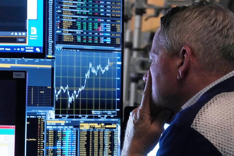 Options trader Paul Magnesio works on the floor of the New York Stock Exchange in June. (AP Photo/Richard Drew)