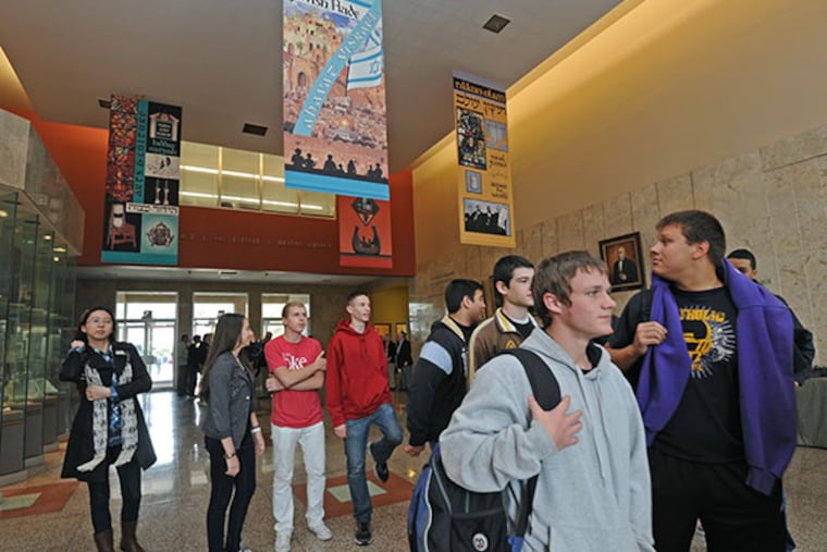 At Keneseth Israel synagogue in Elkins park, Lancaster Catholic High School students meet Holocaust survivors after their trip to the US Holocaust Museum was cancelled due to the government shutdown, on Oct. 15, 2013. Here, students arrive at the synagogue. ( APRIL SAUL / Staff )